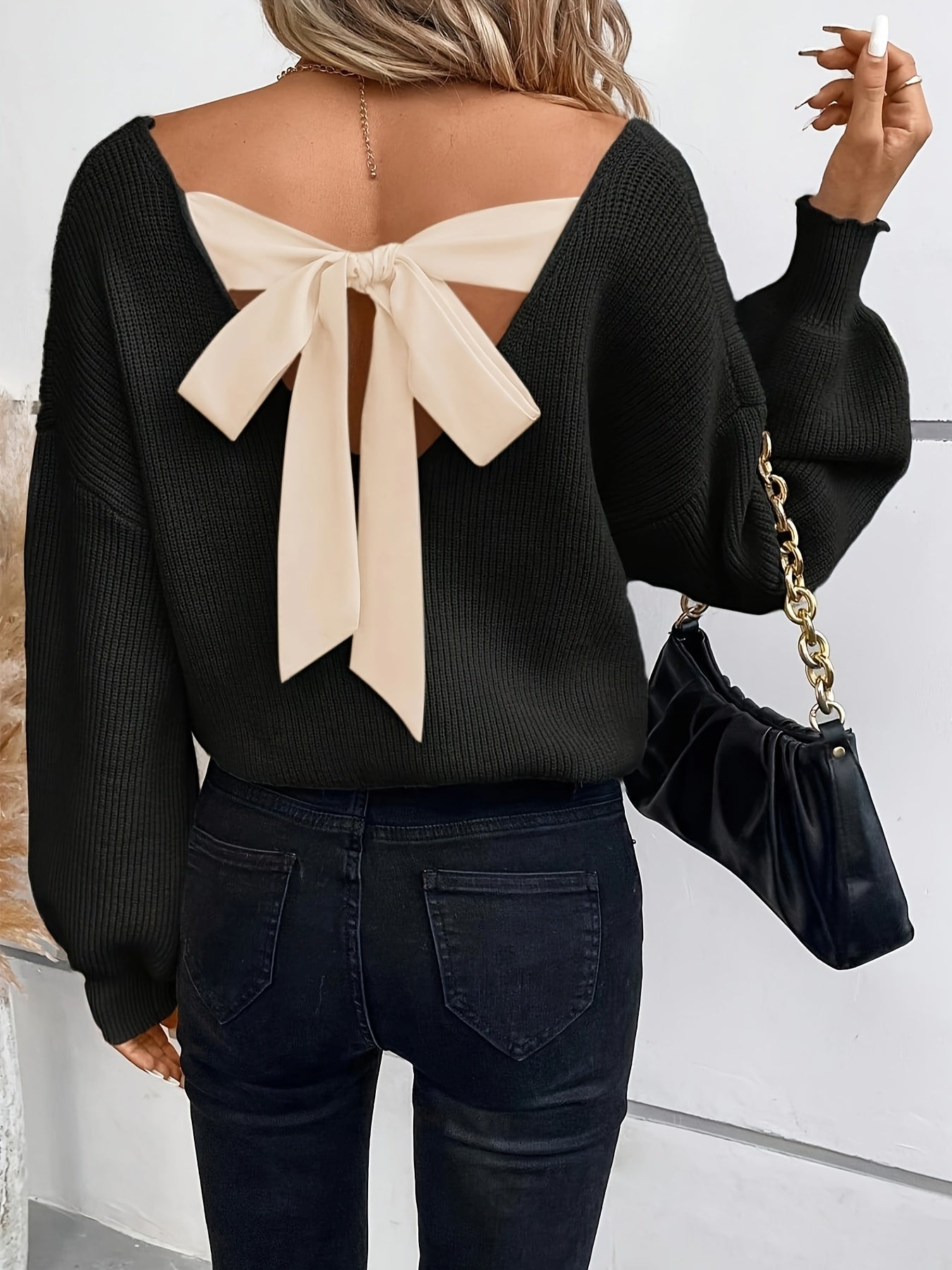Voocci elegant black v-neck sweater with a stylish back bow detail for a chic look