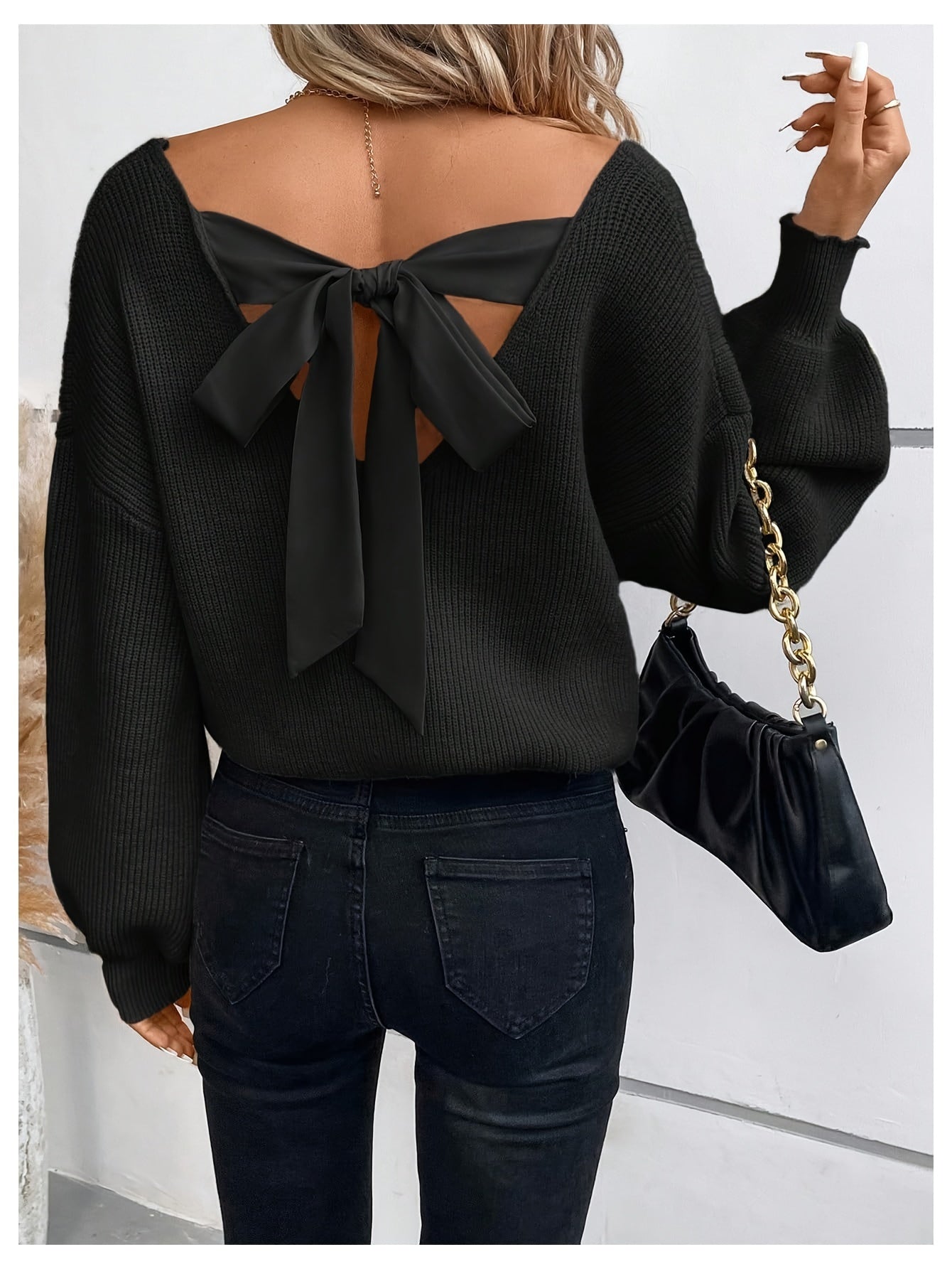 Voocci elegant black v-neck sweater with bow detail and open back for a stylish look