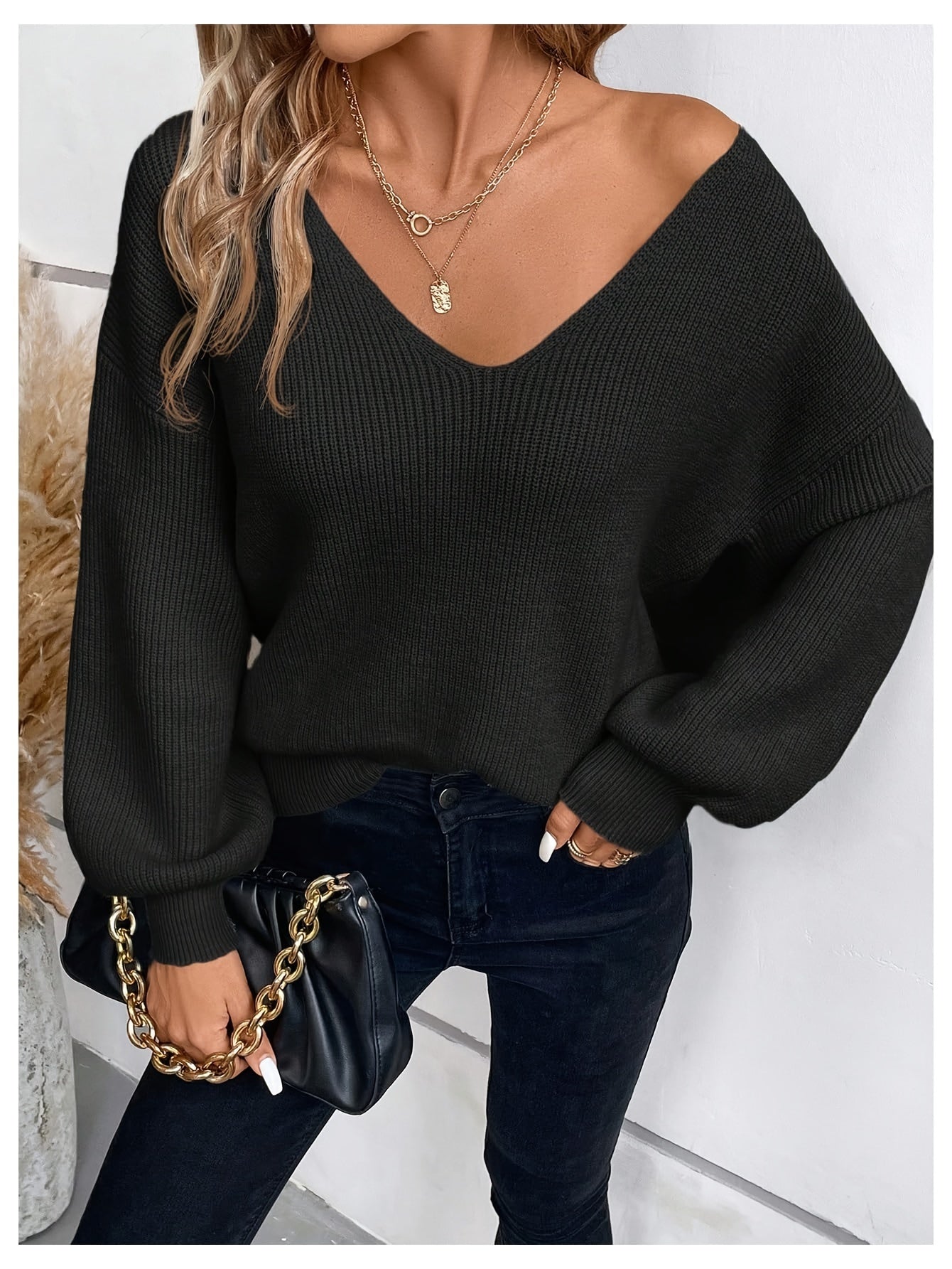 Voocci™ elegant black v-neck sweater featuring a cozy oversized fit and ribbed texture