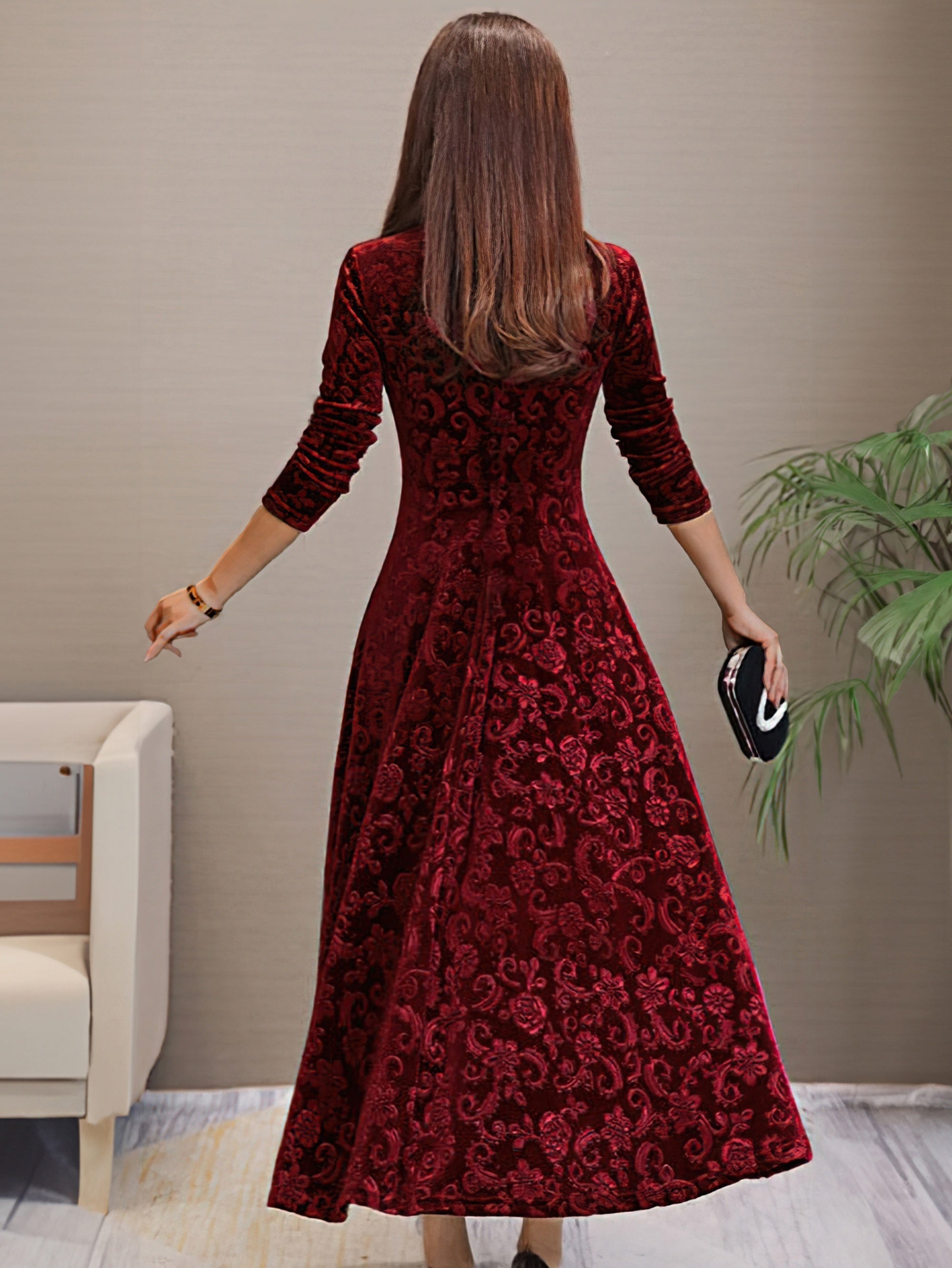 Elegant long sleeve dress in rich burgundy velvet with a flattering fit and flared skirt