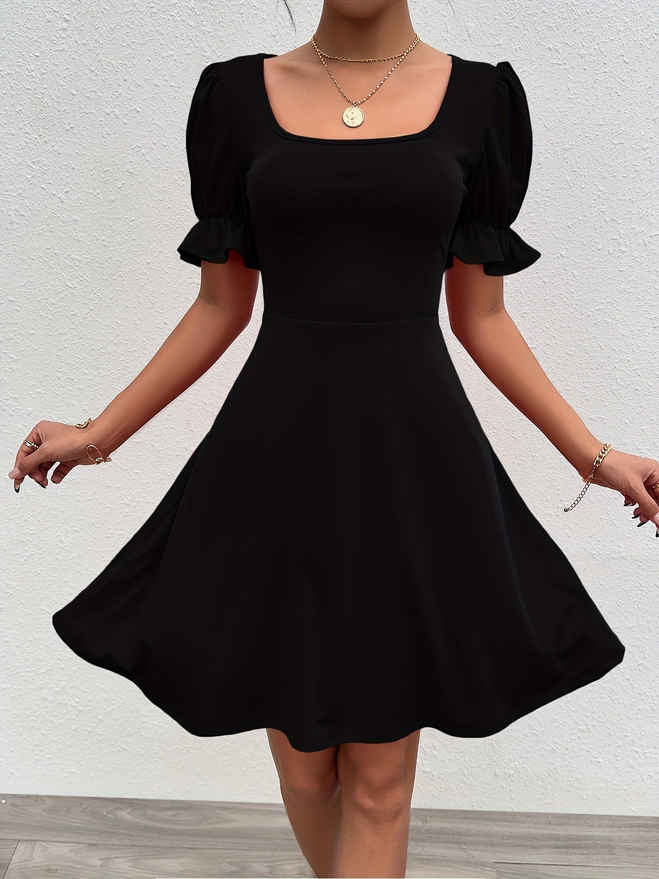 Voocci elegant puff sleeve dress in black with a flattering fit and stylish short sleeves