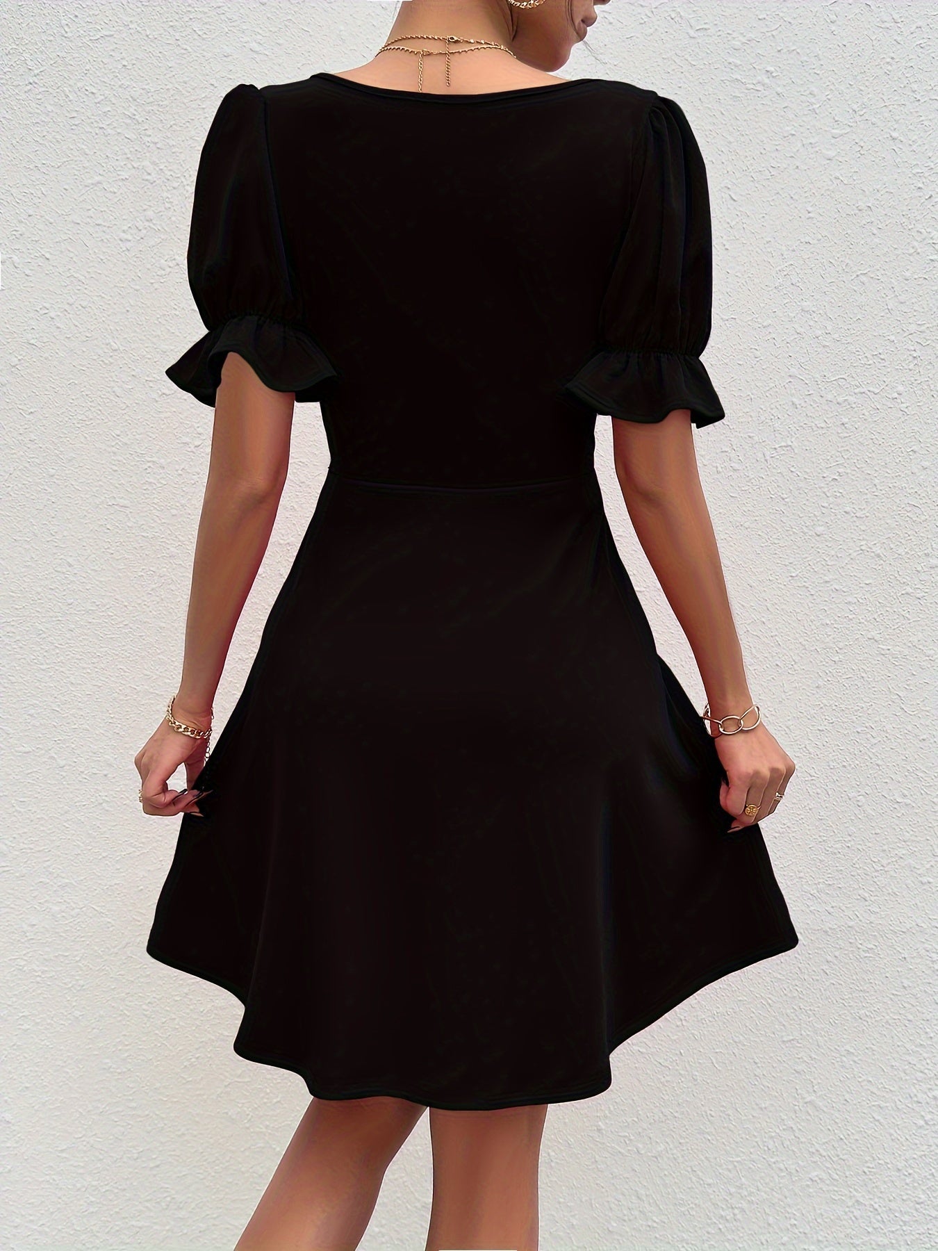 Voocci elegant puff sleeve dress in black with a flared skirt and stylish back design