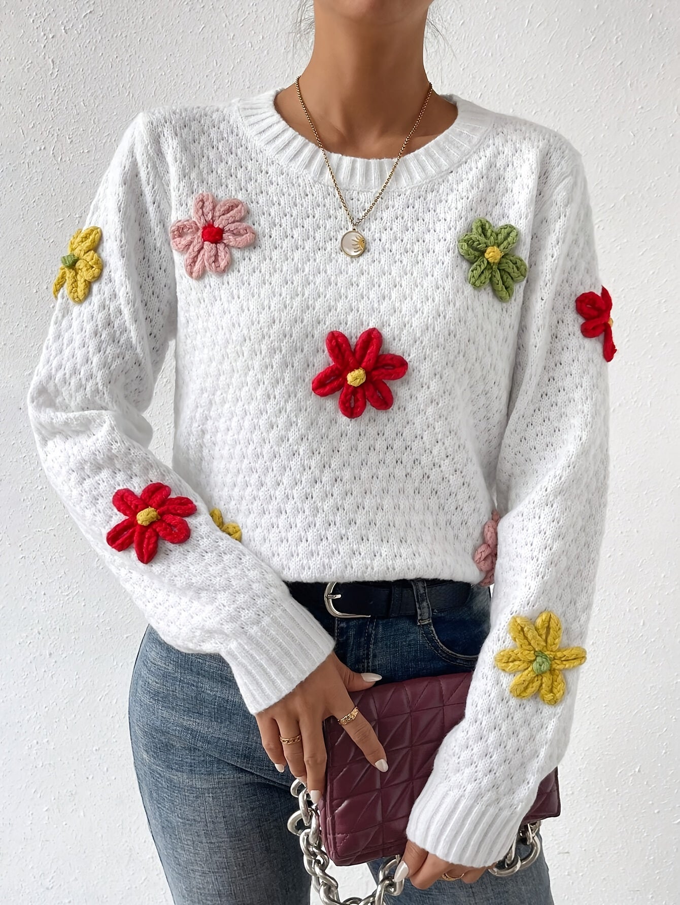 Voocci floral design knitted sweater featuring colorful flower appliques on a white background