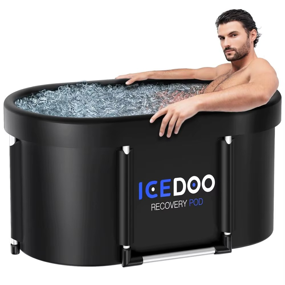 Man relaxing in large oval ice bath tub for enhanced recovery and relaxation