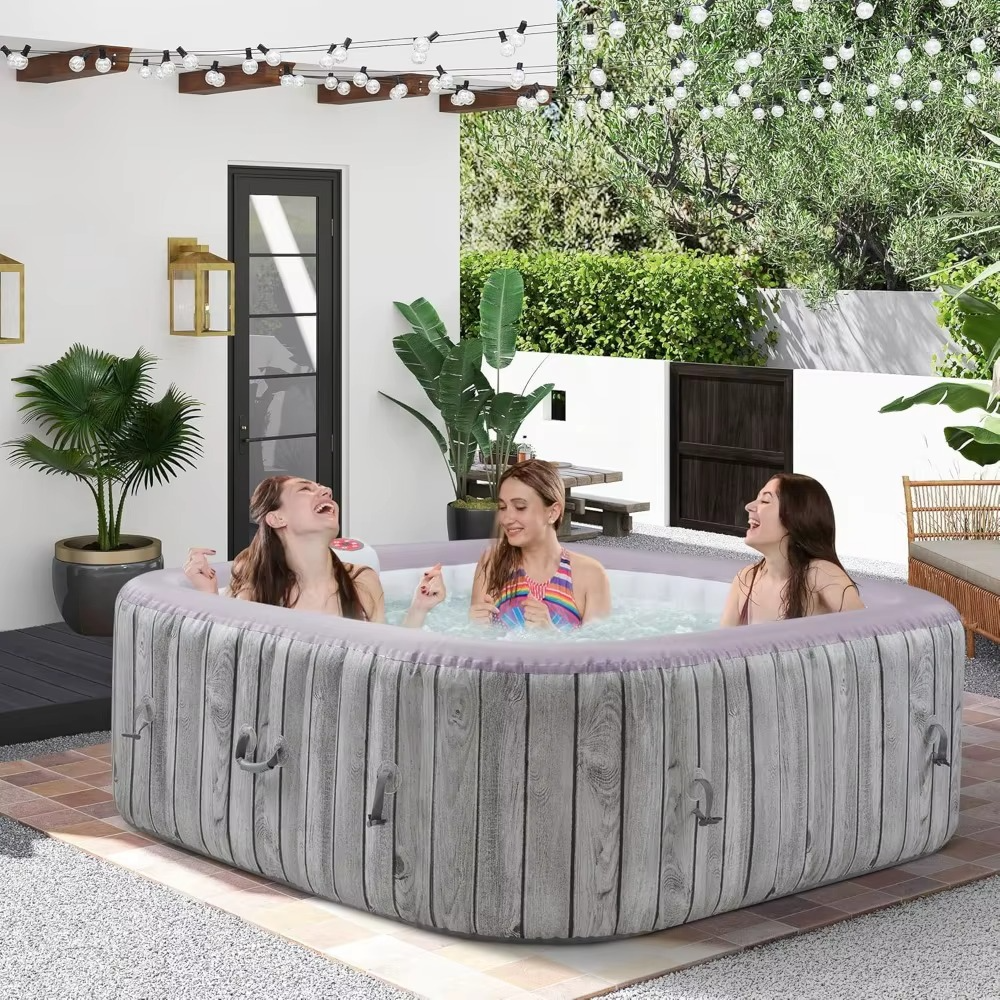 Magazaw portable inflatable hot tub with three friends enjoying a relaxing soak outdoors