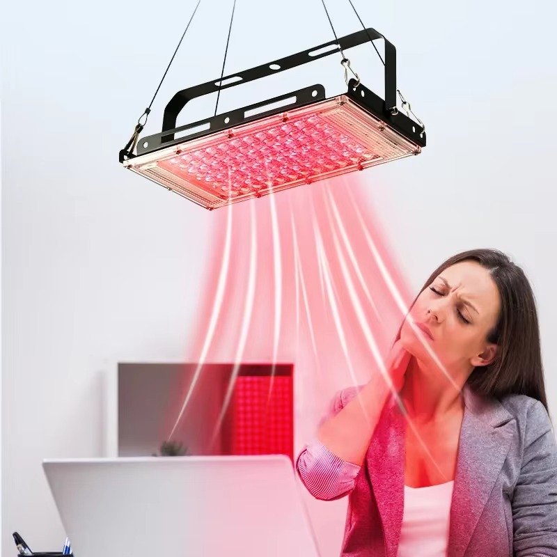 Magazaw red light therapy lamp in use for skin rejuvenation and pain relief at a workspace
