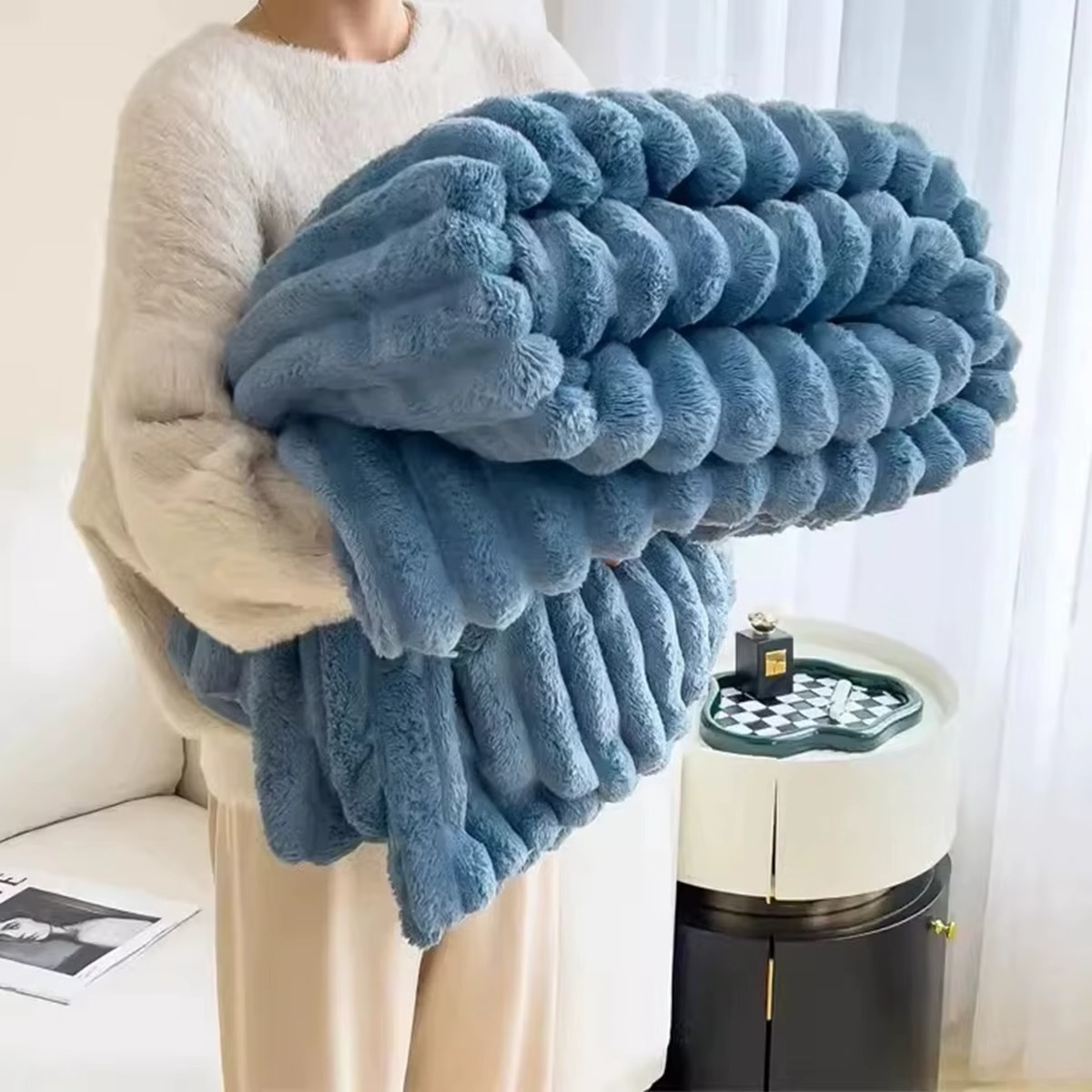 Cozy soft plush velvet blanket in light blue, perfect for warmth and softness on chilly days