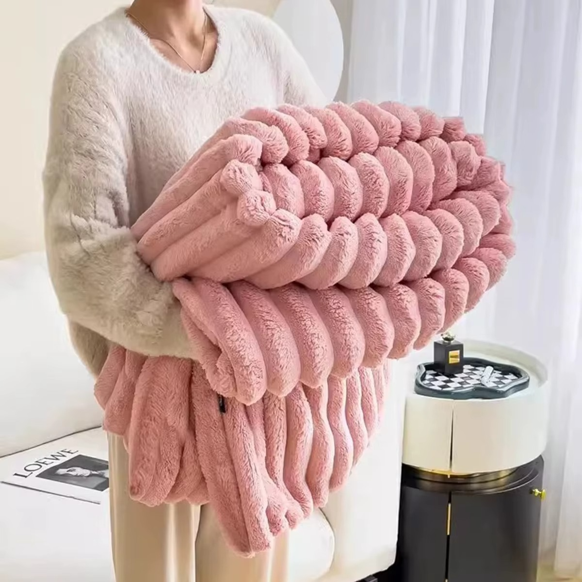Cozy Magazaw soft plush velvet blanket in pastel pink, perfect for warmth and comfort on chilly days