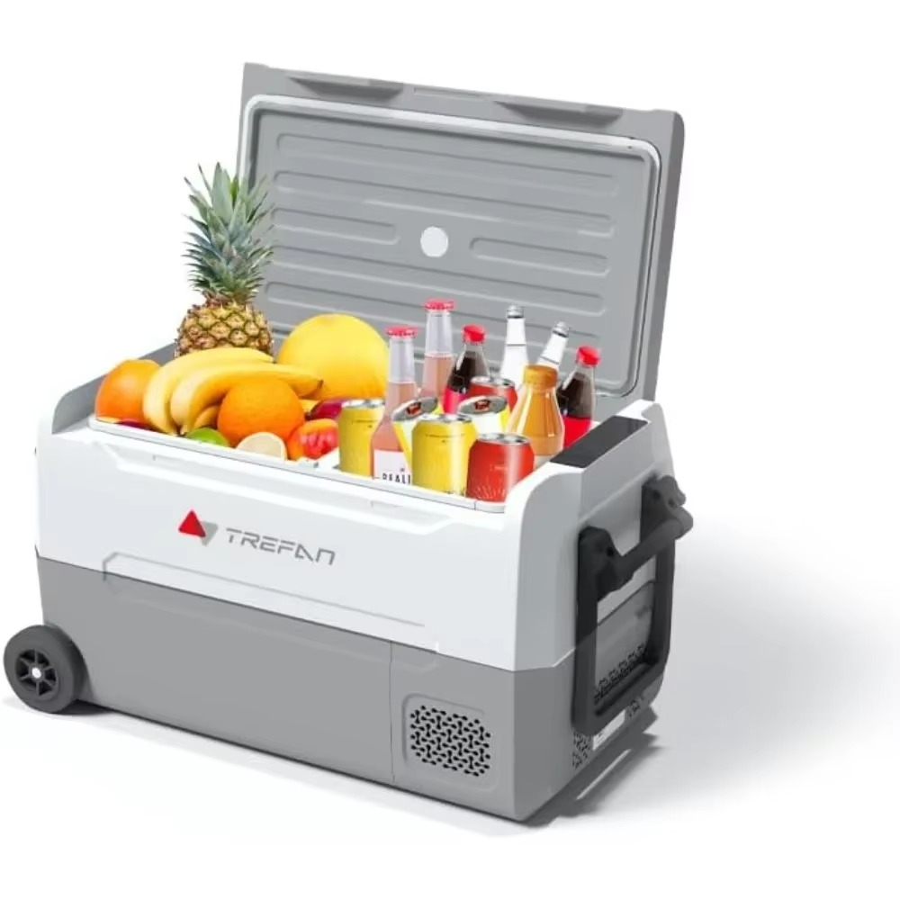 Magazaw portable car refrigerator 12V filled with fruits and beverages for road trips