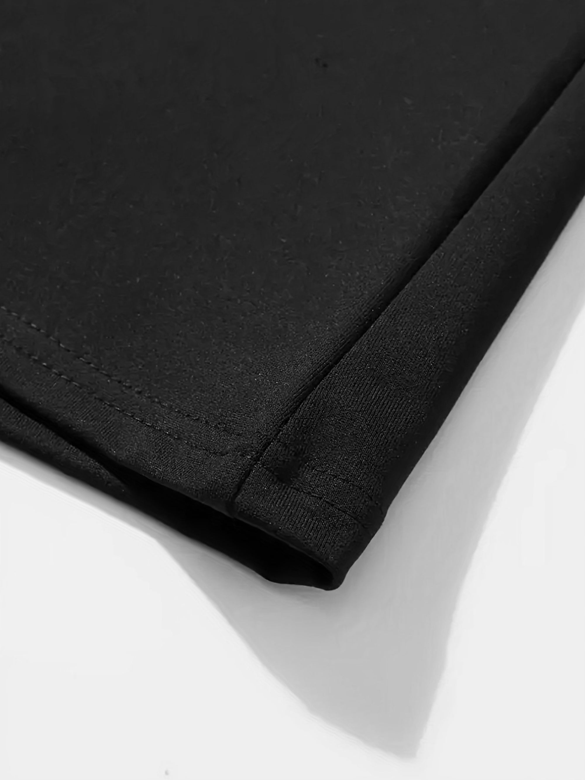 Close-up of the fabric detail of a cold shoulder black dress by Voocci