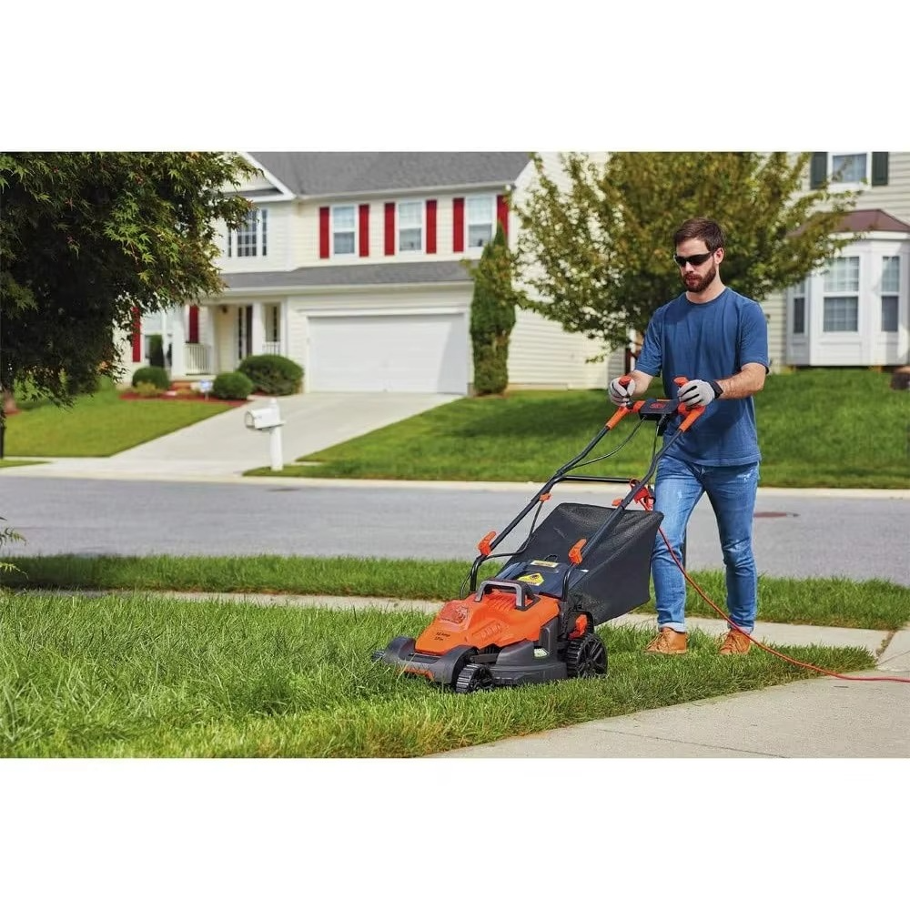 Magazaw Lightweight corded electric mower in action cutting grass on a residential lawn
