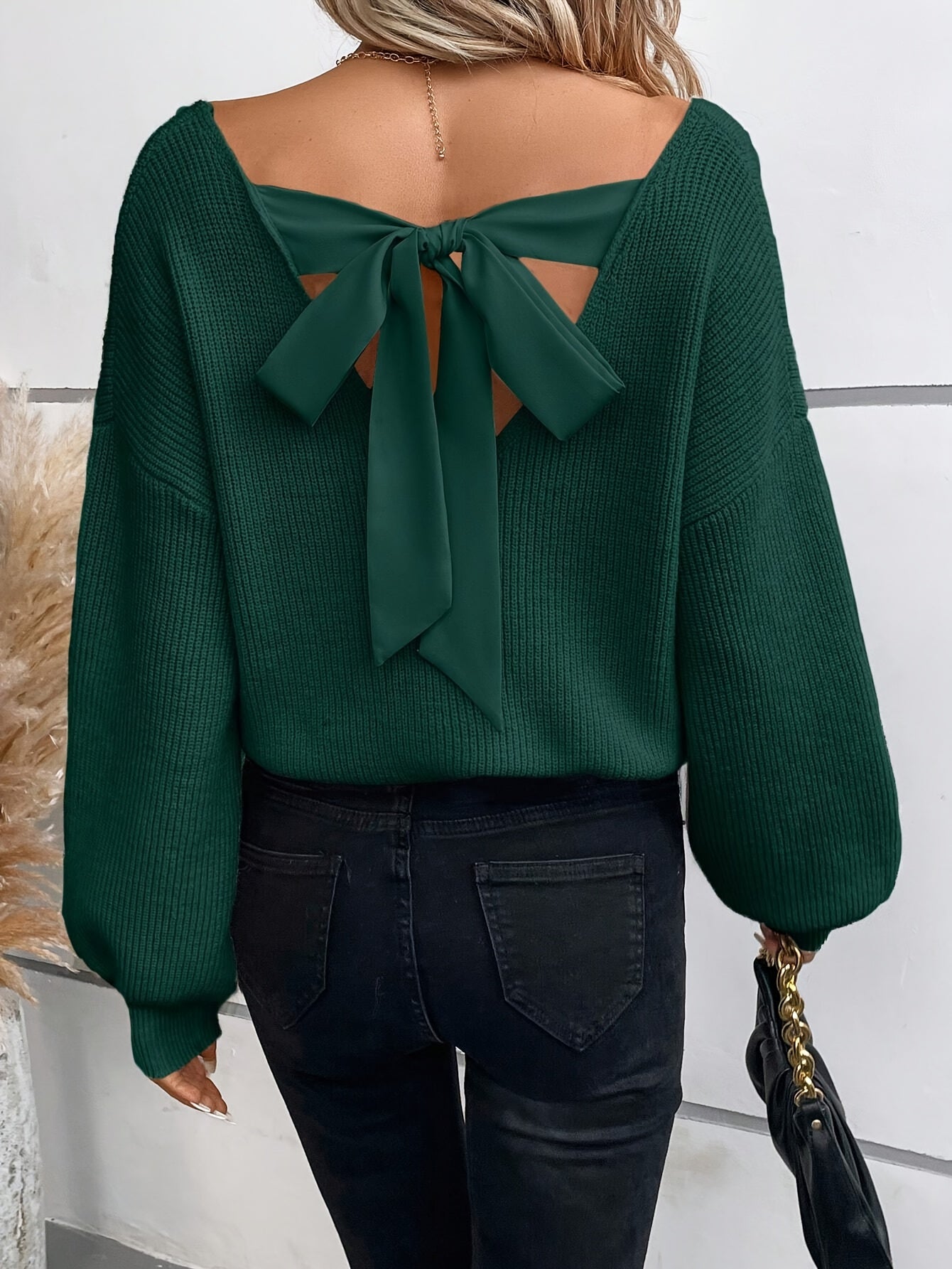 Stylish Voocci™ elegant black v-neck sweater with a bow tie detail at the back