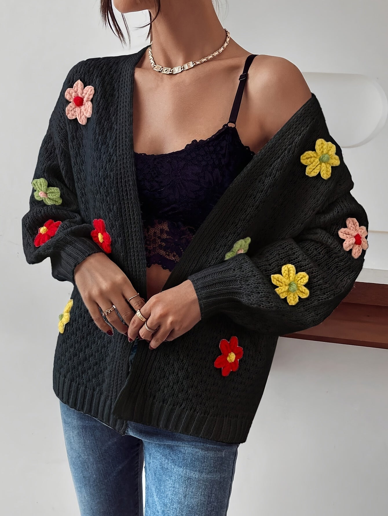 Voocci floral pattern women's cardigan featuring vibrant flower appliques on a dark sweater