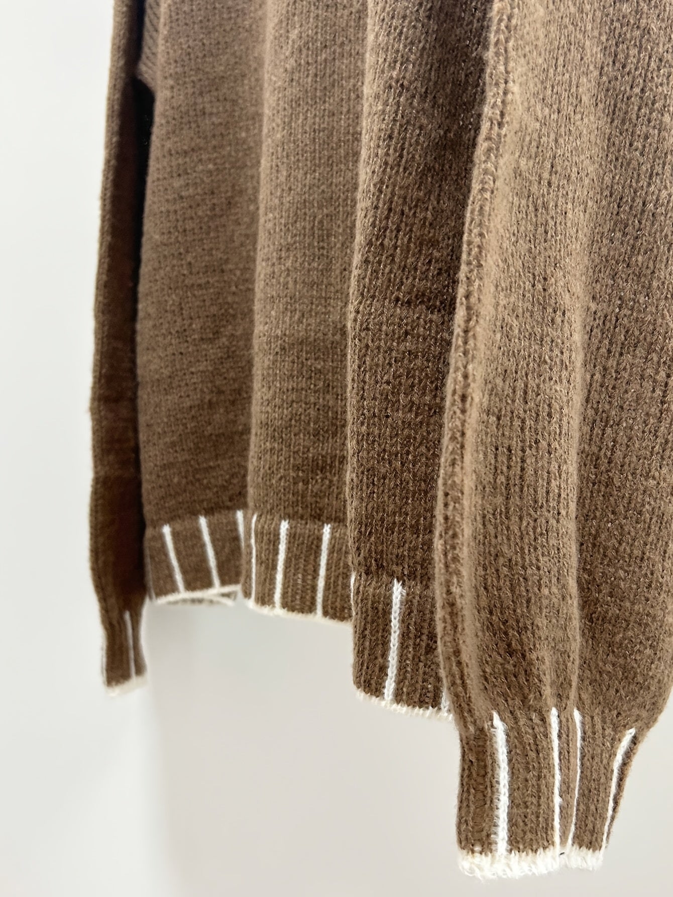 Brown oversized women's sweater by Voocci™ featuring ribbed cuffs for a cozy look