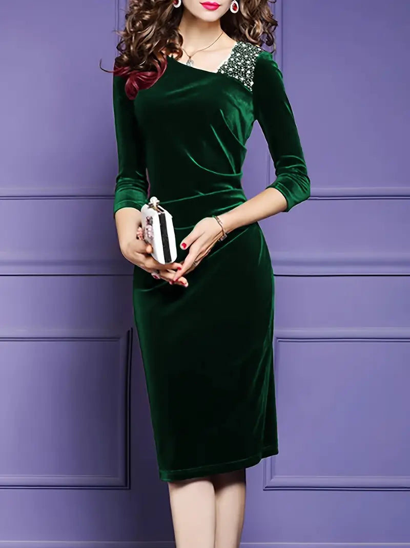 Elegant green velvet midi dress with embellished shoulder perfect for formal occasions