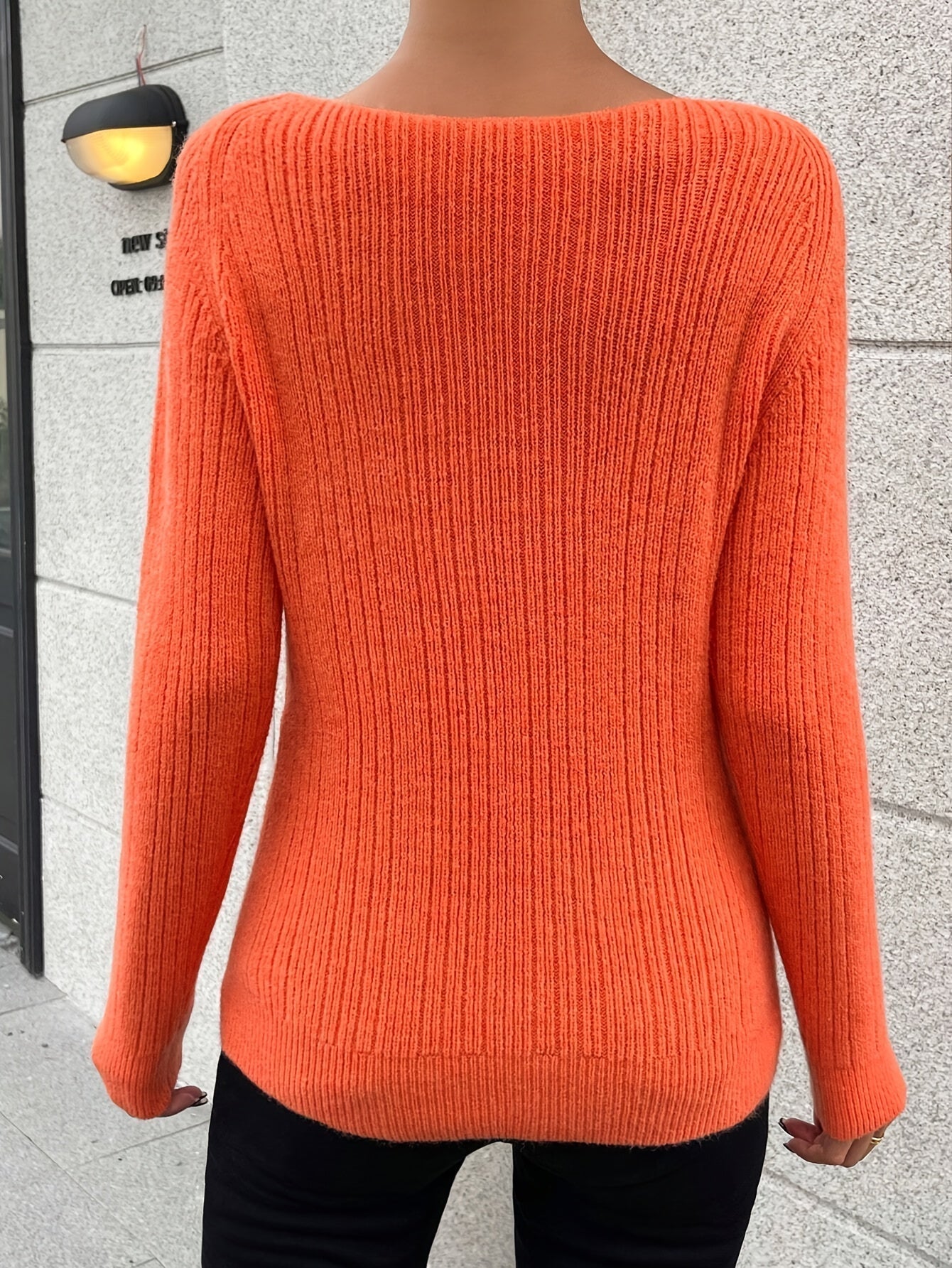 Voocci women's knitted sweater in vibrant orange with a cozy ribbed texture
