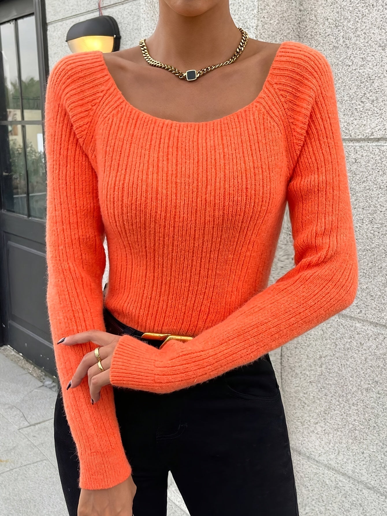 Voocci women's knitted sweater in vibrant orange with a square neckline and ribbed design